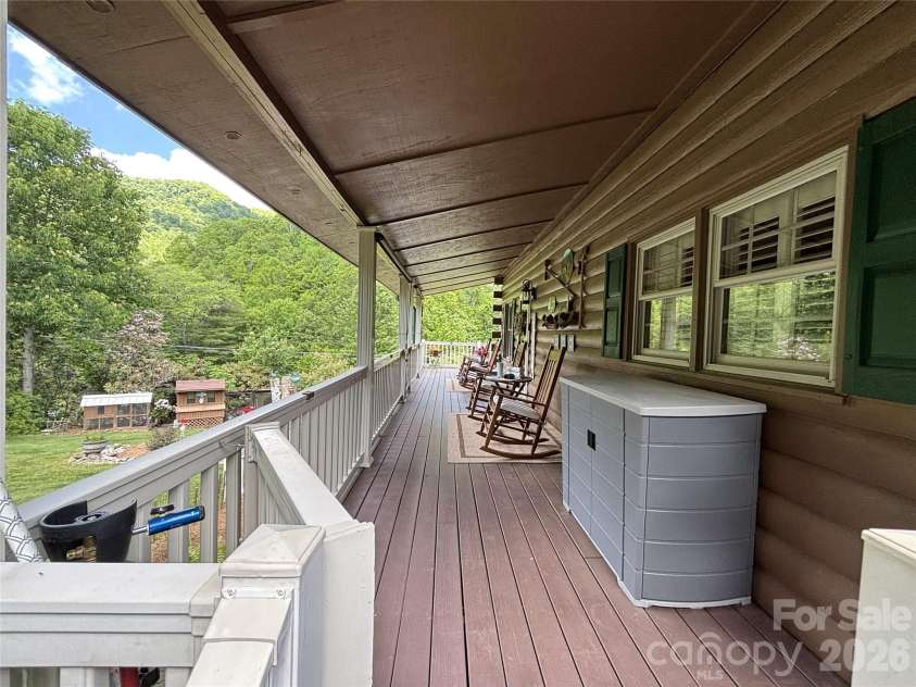 361 Black Camp Gap Road, Maggie Valley, NC 28751.  MLS# CAR4383045, YatesRealty ID 25299. Spacious covered deck