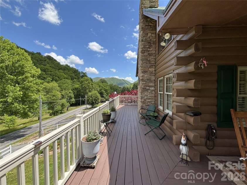 361 Black Camp Gap Road, Maggie Valley, NC 28751.  MLS# CAR4383045, YatesRealty ID 25299. Spacious deck  with a wonderful view.