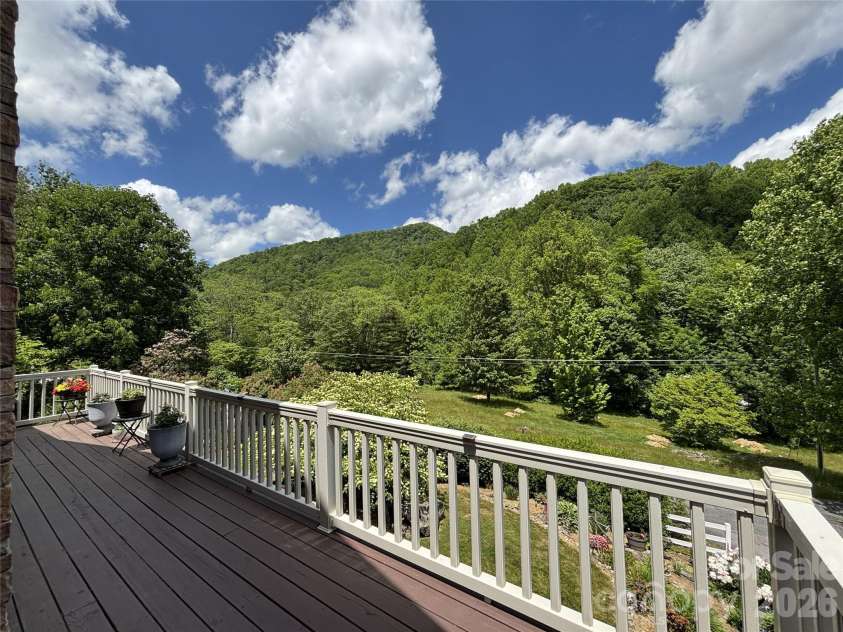 361 Black Camp Gap Road, Maggie Valley, NC 28751.  MLS# CAR4383045, YatesRealty ID 25299. Spacious deck  with a wonderful view.