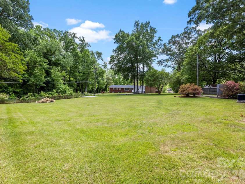 8315 Westbourne Drive, Charlotte, NC 28216.  MLS# CAR4372262, YatesRealty ID 25304. .55 Acre Lot