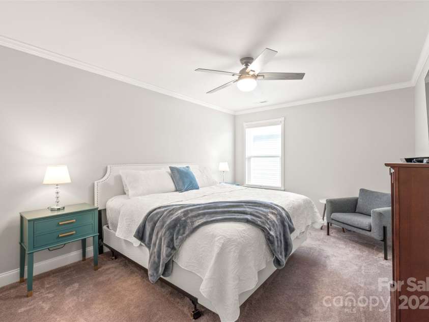 6320 Tilley Way, Matthews, NC 28105.  MLS# CAR4274022, YatesRealty ID 25314. Bedroom 4 offers a spacious closet and direct access to a full bath—perfect for comfort and convenience.