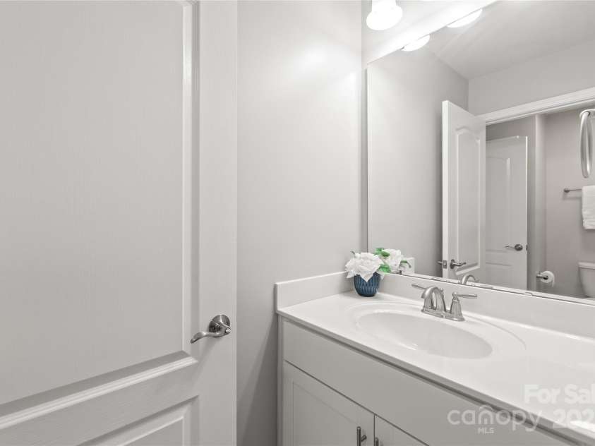 6320 Tilley Way, Matthews, NC 28105.  MLS# CAR4274022, YatesRealty ID 25314. No need to share—Bedroom 2 features its own personal sink in the Jack & Jill bathroom setup.