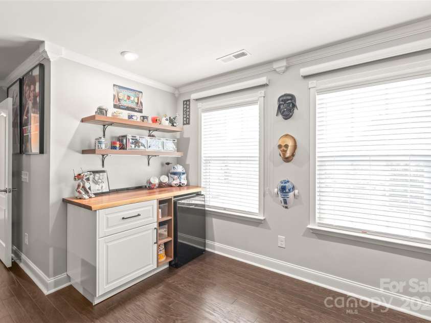 6320 Tilley Way, Matthews, NC 28105.  MLS# CAR4274022, YatesRealty ID 25314. This built-in dry bar in the Bonus Room/Bedroom 5 adds a touch of sophistication and convenience to your entertaining space.