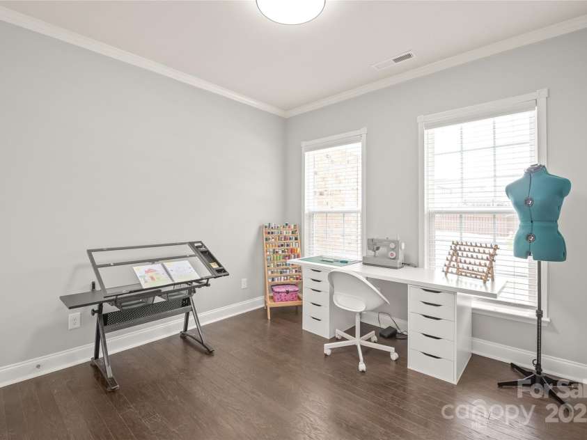 6320 Tilley Way, Matthews, NC 28105.  MLS# CAR4274022, YatesRealty ID 25314. This light-filled flex space with glass door and walk-in closet is perfect as a private office, guest room, or hobby space.