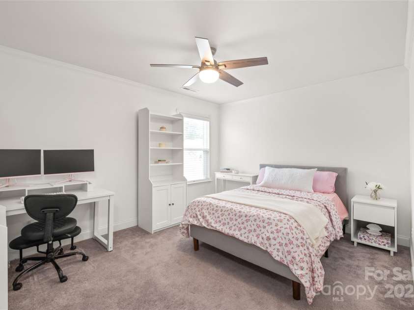 6320 Tilley Way, Matthews, NC 28105.  MLS# CAR4274022, YatesRealty ID 25314. Thoughtfully designed, Bedroom 3 includes a walk-in closet and private sink—ideal for shared living without sacrificing privacy.