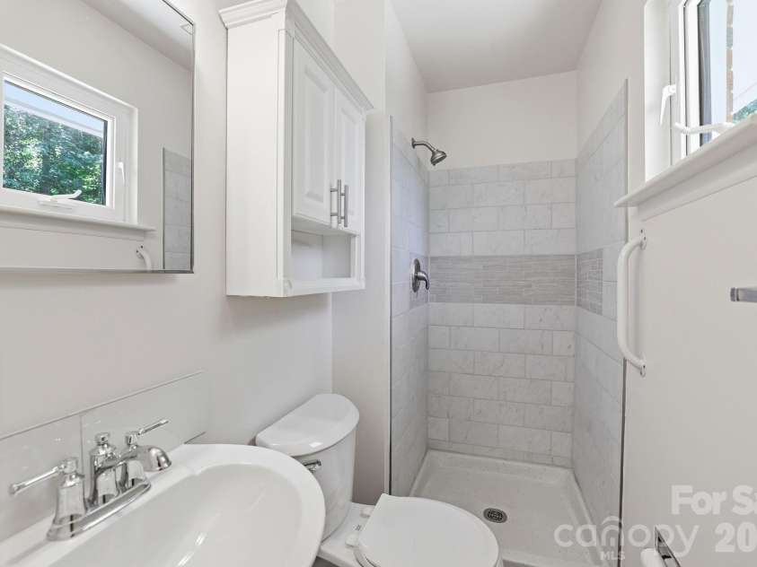 225 Middleton Avenue, Matthews, NC 28104.  MLS# CAR4379594, YatesRealty ID 25317. Primary bathroom