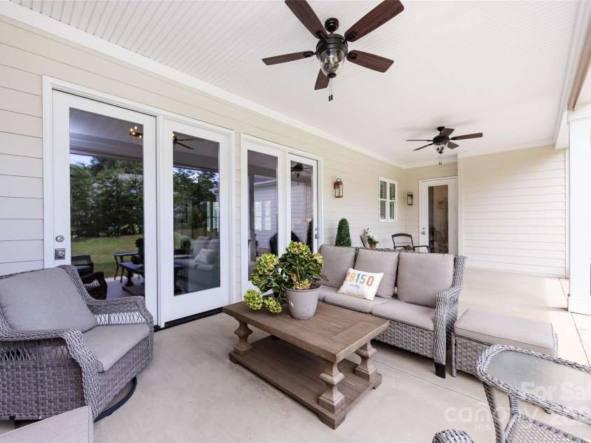 416 Yorkfield Drive, Shelby, NC 28150.  MLS# CAR4276918, YatesRealty ID 25318. Covered, expansive back porch with dual ceiling fans & plenty of room for relaxing or entertaining!