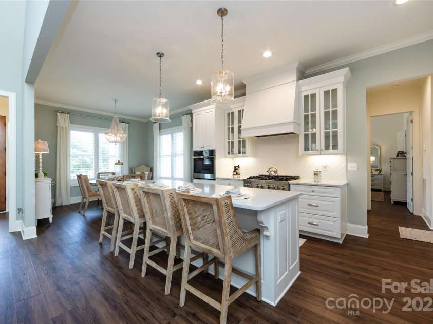 416 Yorkfield Drive, Shelby, NC 28150.  MLS# CAR4276918, YatesRealty ID 25318. Gourmet Kitchen offers quartz counters, stainless steel appliances including 6 burner gas zline stove, tile back splash, custom cabinets, farmhouse sink, large center island with seating/storage, designer lighting, plenty