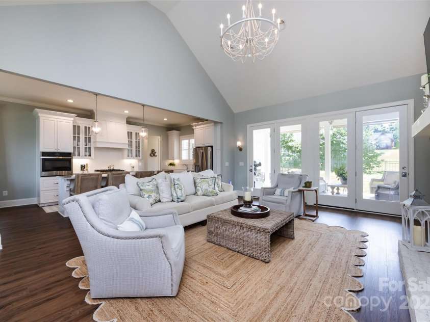 416 Yorkfield Drive, Shelby, NC 28150.  MLS# CAR4276918, YatesRealty ID 25318. Vaulted Great Room with brick surround gas fireplace, custom chandelier, LVP floors & access to covered patio!