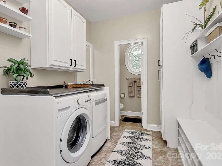 514 Bethel School Road, Clover, SC 29710.  MLS# CAR4278192, YatesRealty ID 25320. Convenient location off the garage, this mudroom includes dropzone, built in storage, wash sink, laundry, AND full bath