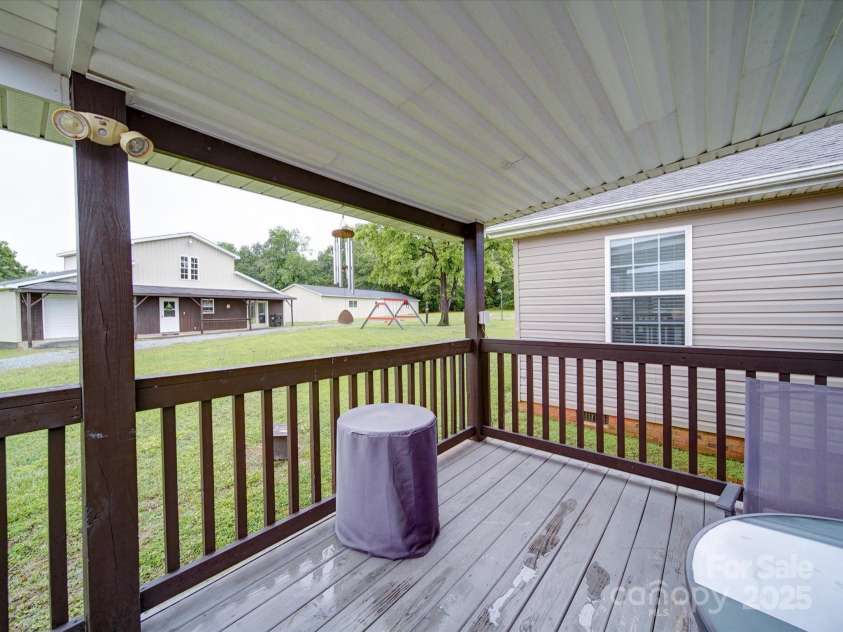 4115 Jenkins Road, Marshville, NC 28103.  MLS# CAR4325461, YatesRealty ID 25324. Back porch