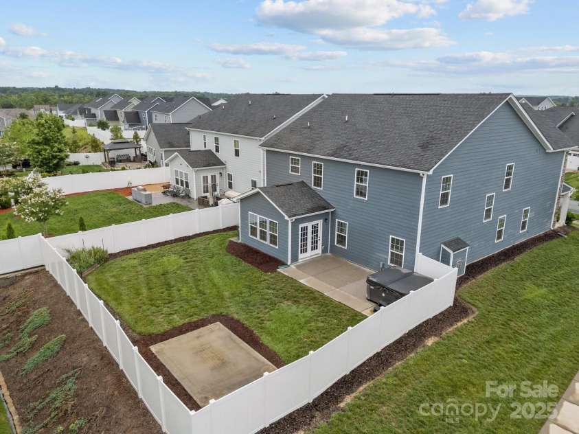 12710 ES Draper Drive, Huntersville, NC 28078.  MLS# CAR4245937, YatesRealty ID 25327. Aerial view of the fully fenced backyard