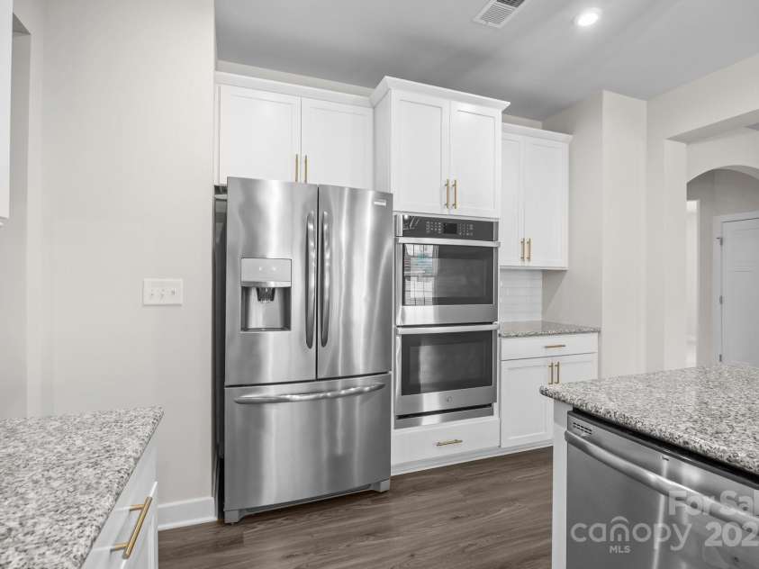 12710 ES Draper Drive, Huntersville, NC 28078.  MLS# CAR4245937, YatesRealty ID 25327. Built in oven and microwave, along with dishwasher and fridge all convey