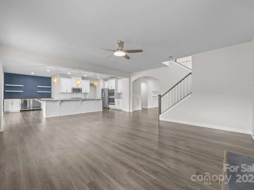 12710 ES Draper Drive, Huntersville, NC 28078.  MLS# CAR4245937, YatesRealty ID 25327. Expansive living room with LVP throughout