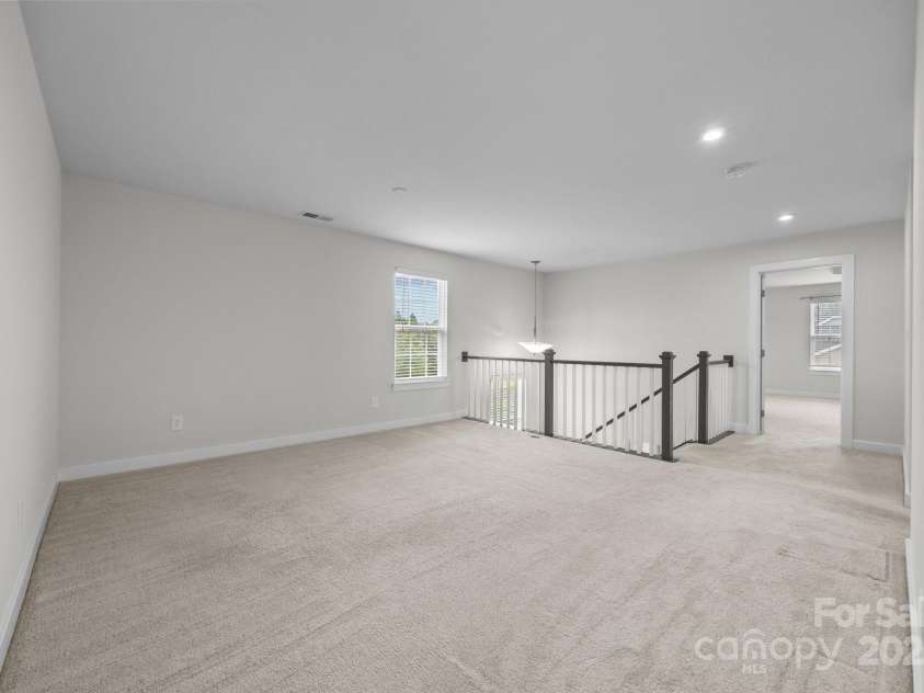 12710 ES Draper Drive, Huntersville, NC 28078.  MLS# CAR4245937, YatesRealty ID 25327. Loft at the top of the stairs