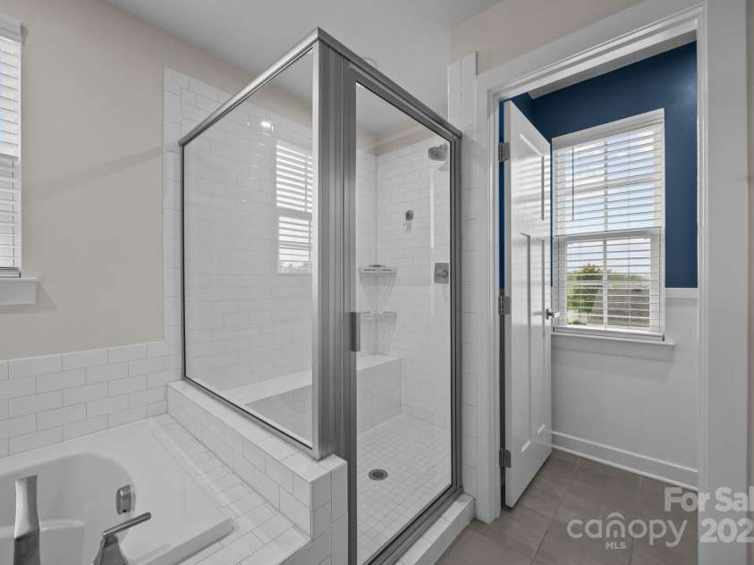 12710 ES Draper Drive, Huntersville, NC 28078.  MLS# CAR4245937, YatesRealty ID 25327. Private water closet past the tub and shower