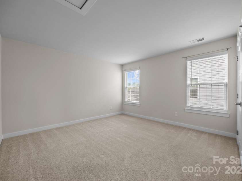 12710 ES Draper Drive, Huntersville, NC 28078.  MLS# CAR4245937, YatesRealty ID 25327. Secondary bedroom