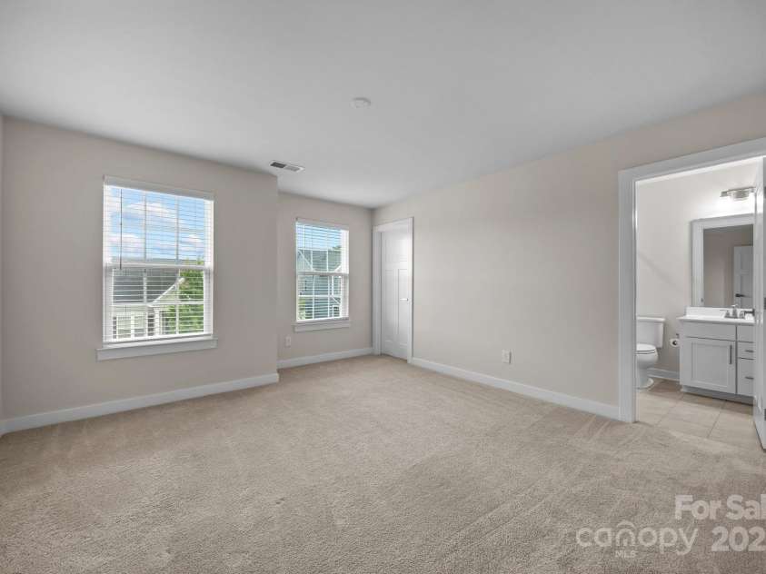 12710 ES Draper Drive, Huntersville, NC 28078.  MLS# CAR4245937, YatesRealty ID 25327. Secondary bedroom with en-suite bath