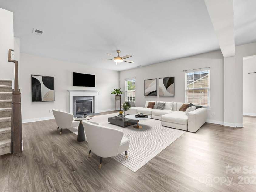 12710 ES Draper Drive, Huntersville, NC 28078.  MLS# CAR4245937, YatesRealty ID 25327. Virtual staging of the expansive living room with loads of natural light