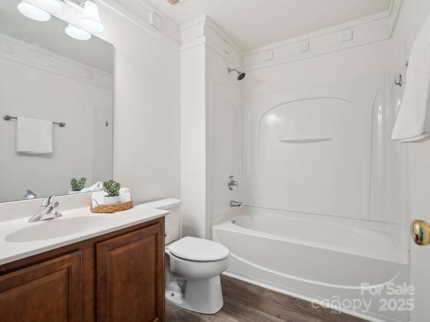 146 Rapids Road, Fort Mill, SC 29715.  MLS# CAR4269060, YatesRealty ID 25328. Guest Bathroom has Laminate  flooring and crown molding