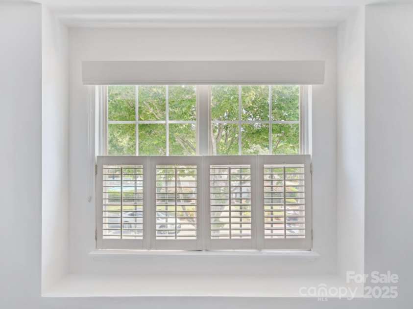 146 Rapids Road, Fort Mill, SC 29715.  MLS# CAR4269060, YatesRealty ID 25328. Guest Bedroom has a cute reading nook and a view of the neighborhood pool.