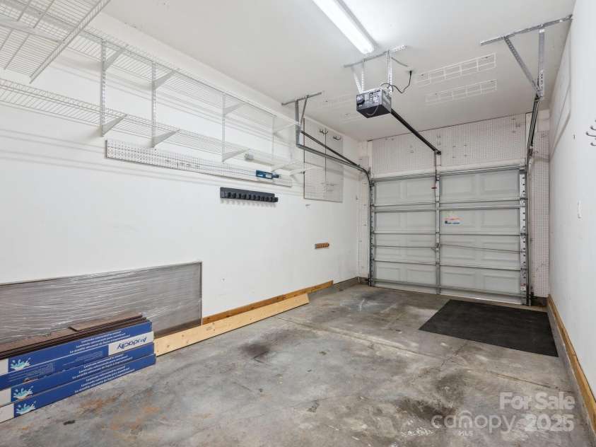146 Rapids Road, Fort Mill, SC 29715.  MLS# CAR4269060, YatesRealty ID 25328. Single car garage has built in storage