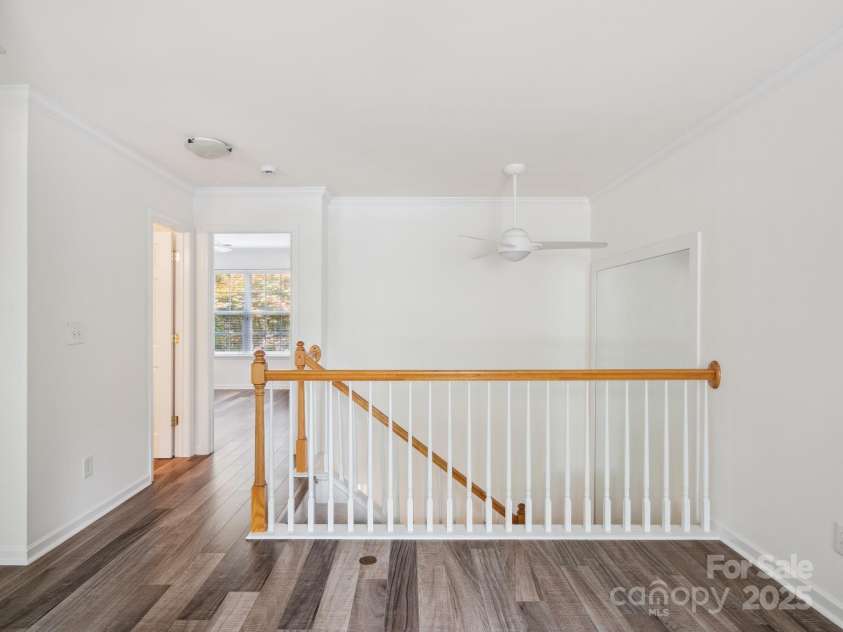 146 Rapids Road, Fort Mill, SC 29715.  MLS# CAR4269060, YatesRealty ID 25328. Upstairs loft is large with laminate flooring and crown molding.