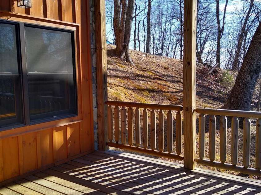 109 Overlook Point Lane, Lake Lure, NC 28746.  MLS# CAR4336925, YatesRealty ID 2533. Lower deck covered porch facing the views
