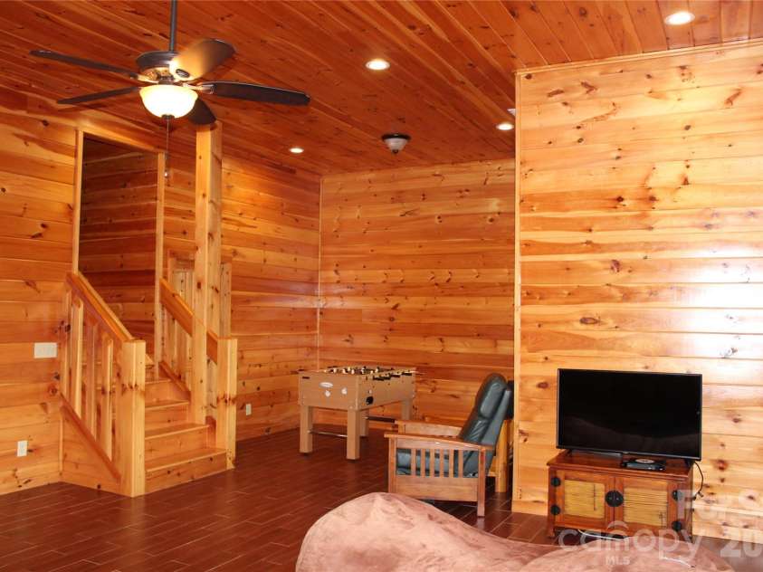 109 Overlook Point Lane, Lake Lure, NC 28746.  MLS# CAR4336925, YatesRealty ID 2533. Lower-Level Family Room
