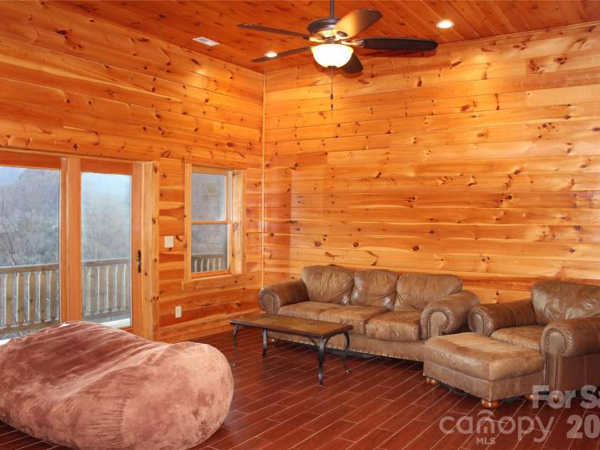109 Overlook Point Lane, Lake Lure, NC 28746.  MLS# CAR4336925, YatesRealty ID 2533. Lower Level Family Room with soaring ceilings
