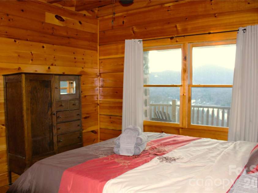 109 Overlook Point Lane, Lake Lure, NC 28746.  MLS# CAR4336925, YatesRealty ID 2533. Main floor Master bedroom