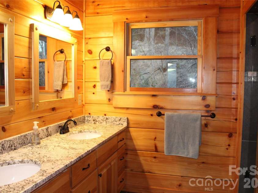 109 Overlook Point Lane, Lake Lure, NC 28746.  MLS# CAR4336925, YatesRealty ID 2533. Master bathroom with large tile/stone shower