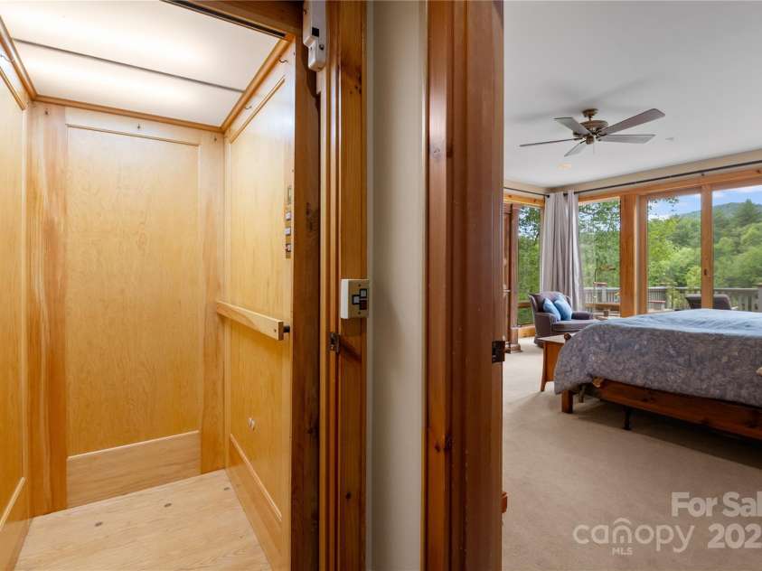 56 The Rapids Road, Sapphire, NC 28774.  MLS# CAR4273720, YatesRealty ID 25333. Elevator