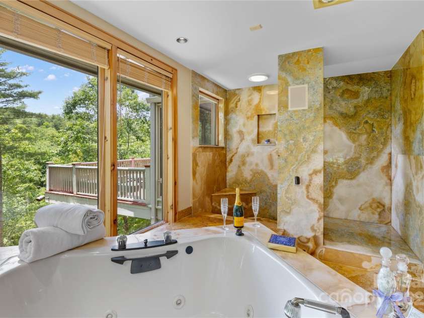 56 The Rapids Road, Sapphire, NC 28774.  MLS# CAR4273720, YatesRealty ID 25333. Owner's Bath