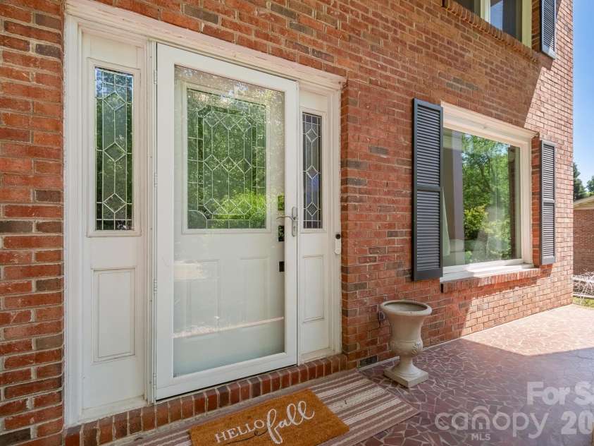6070 Ferncliff Drive, Concord, NC 28027.  MLS# CAR4371850, YatesRealty ID 25333. Expansive front porch.