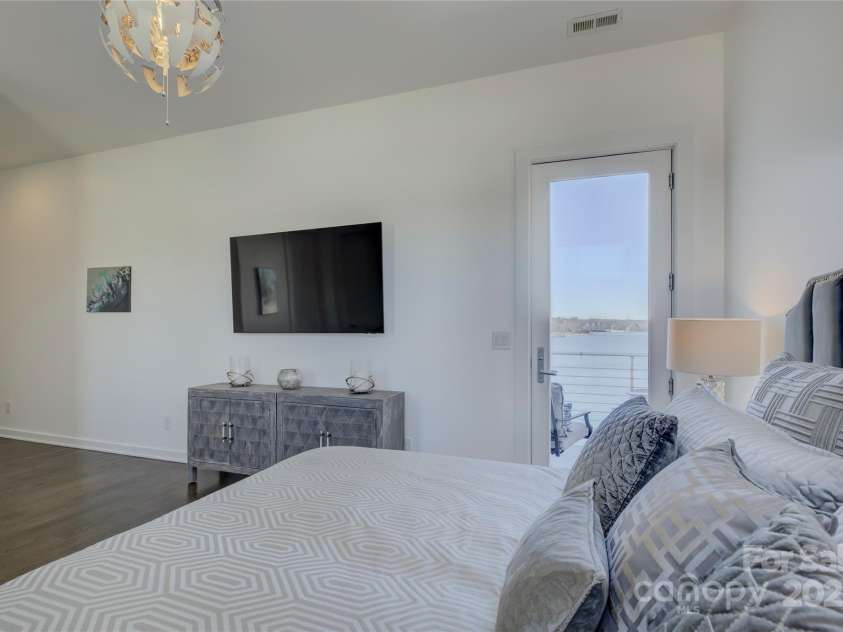 7111 Anchorage Lane, Tega Cay, SC 29708.  MLS# CAR4224144, YatesRealty ID 2534. Guest bedroom with a balcony