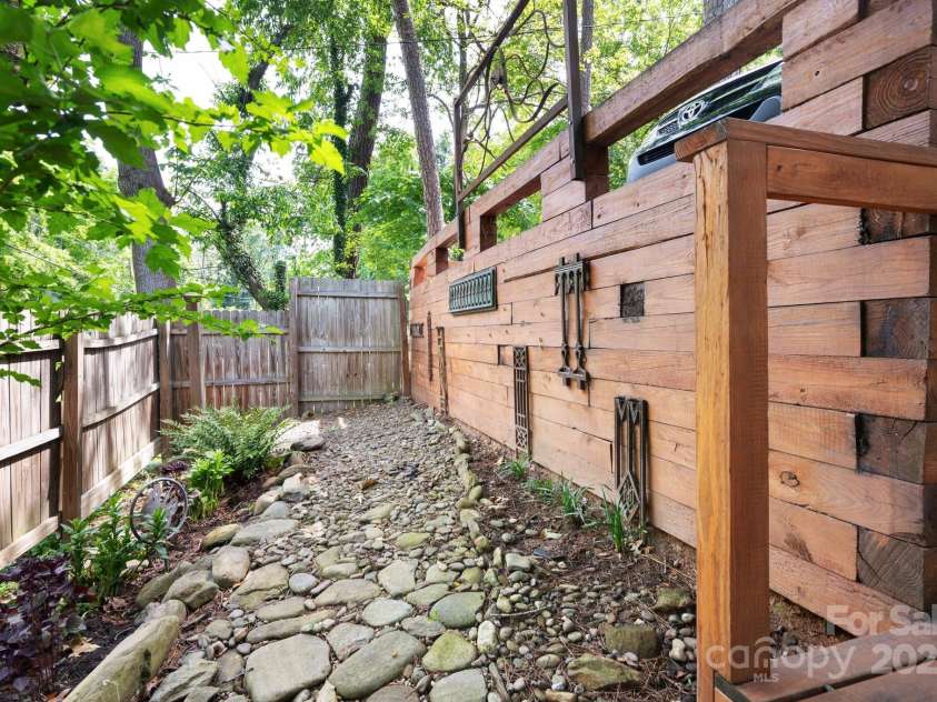 5 Arbutus Road, Asheville, NC 28805.  MLS# CAR4270691, YatesRealty ID 25344. Private Garden for Lower Unit