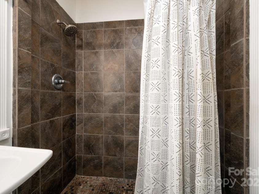 5 Arbutus Road, Asheville, NC 28805.  MLS# CAR4270691, YatesRealty ID 25344. Tiled Shower