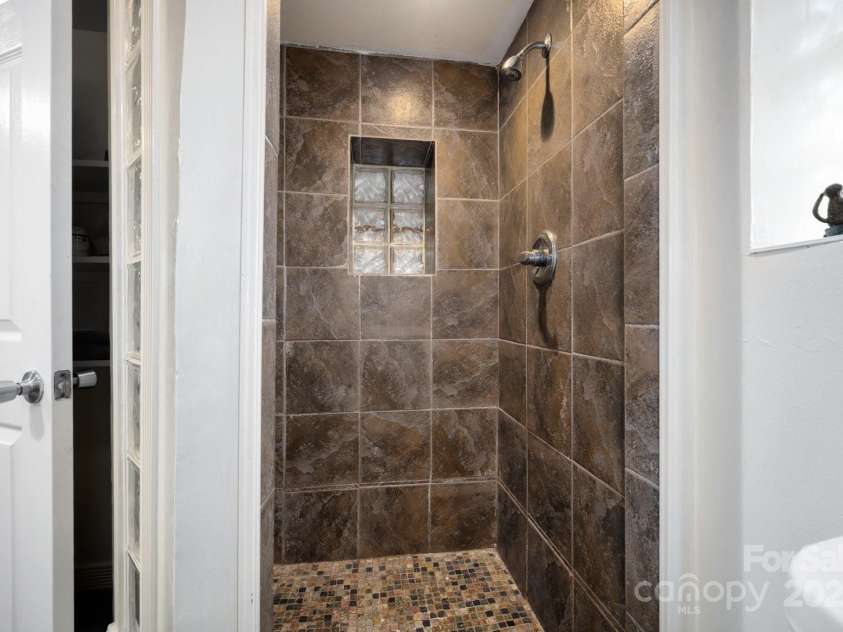 5 Arbutus Road, Asheville, NC 28805.  MLS# CAR4270691, YatesRealty ID 25344. Tiled Shower