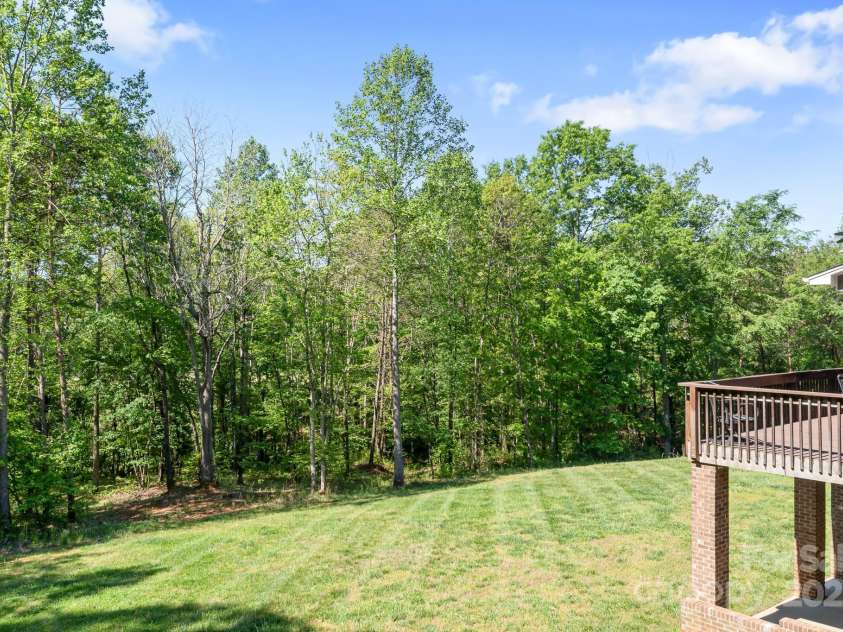 730 Oak Ridge Farms Circle, Newton, NC 28658.  MLS# CAR4252238, YatesRealty ID 25347. Backyard from left side of home