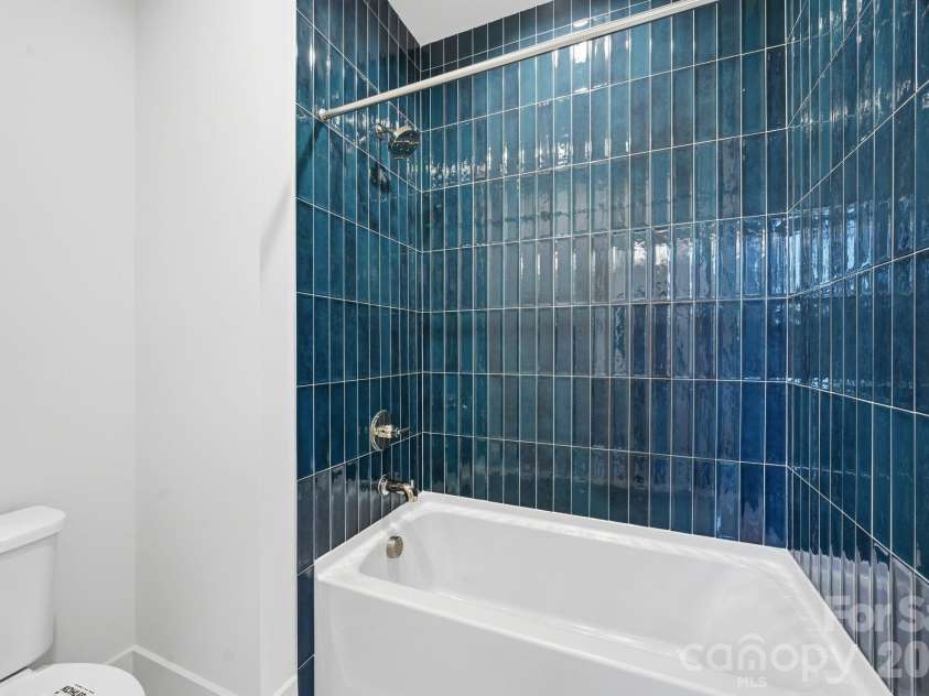 7237 Westrow Avenue, Charlotte, NC 28278.  MLS# CAR4311743, YatesRealty ID 2535. Bath #2 showcases a wonderful soaker tub in a tile oasis.