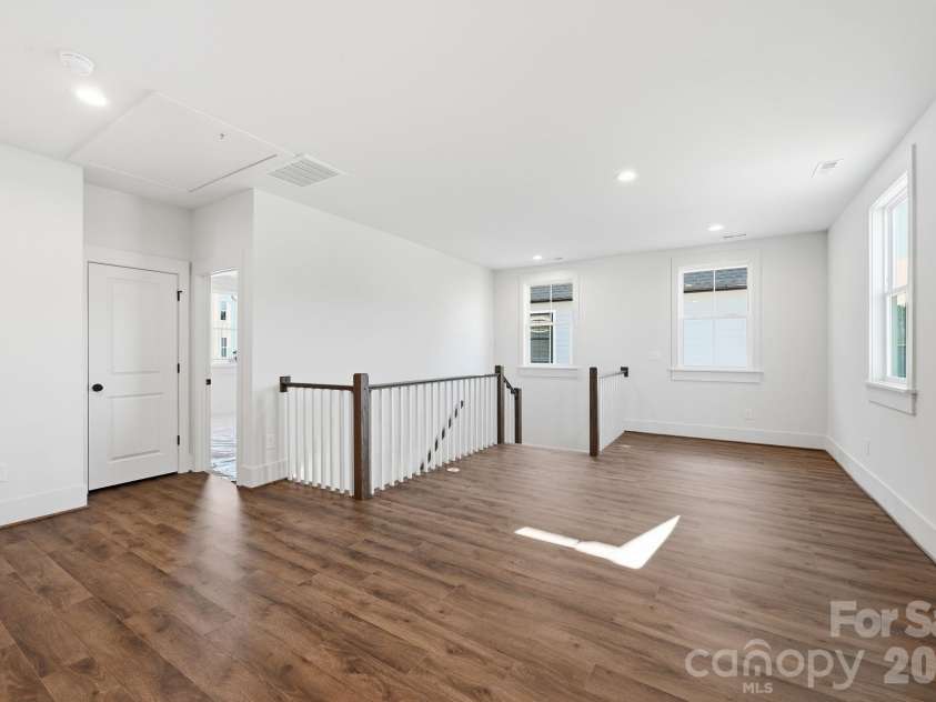 7237 Westrow Avenue, Charlotte, NC 28278.  MLS# CAR4311743, YatesRealty ID 2535. Fun flowing second floor loft space with open railing. 