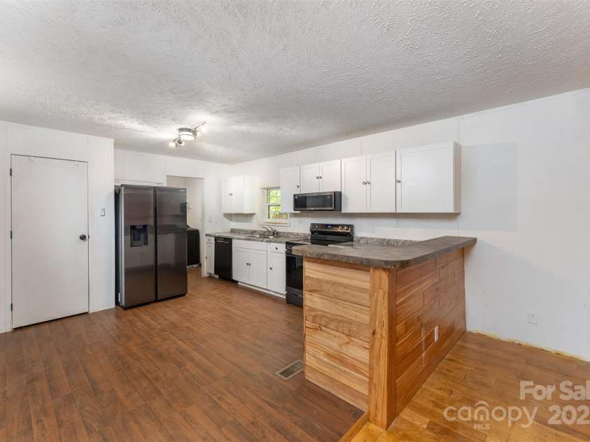 116 Hidden Meadow Drive, Candler, NC 28715.  MLS# CAR4258424, YatesRealty ID 25356. Kitchen and Dining Area