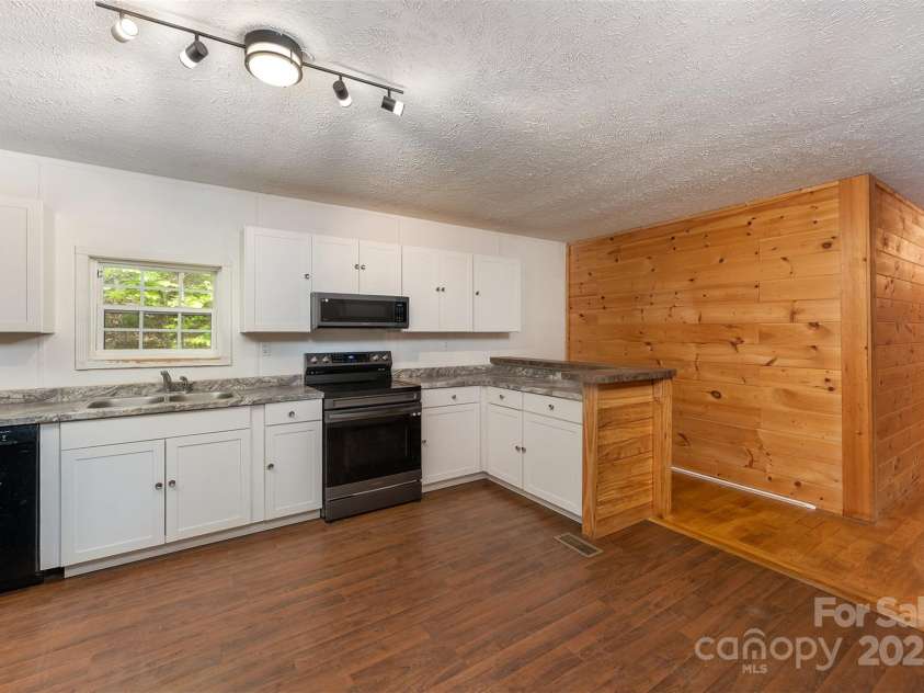 116 Hidden Meadow Drive, Candler, NC 28715.  MLS# CAR4258424, YatesRealty ID 25356. Kitchen and Dining Area