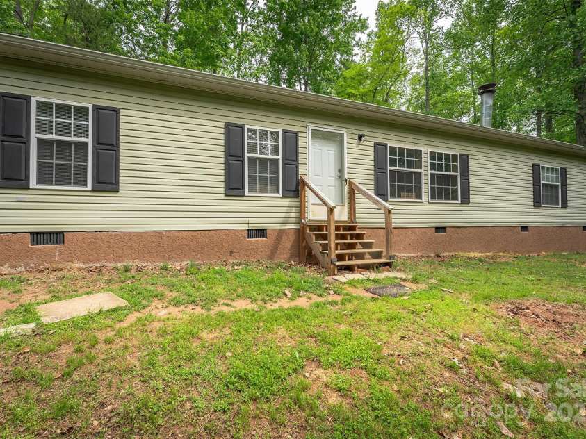 116 Hidden Meadow Drive, Candler, NC 28715.  MLS# CAR4258424, YatesRealty ID 25356. West Exterior