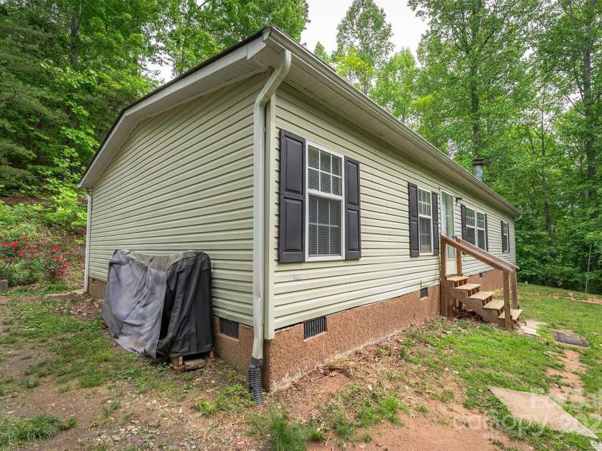 116 Hidden Meadow Drive, Candler, NC 28715.  MLS# CAR4258424, YatesRealty ID 25356. West Exterior
