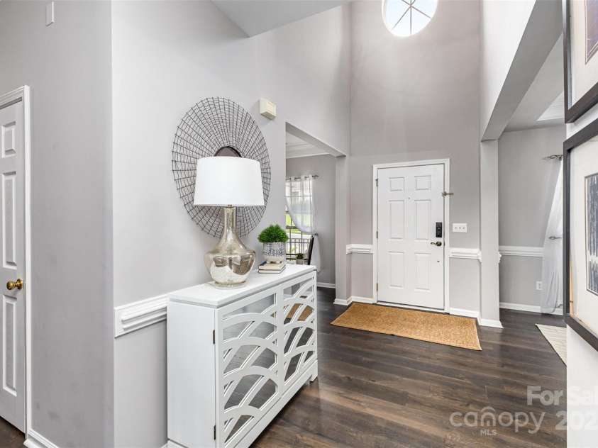 10198 Tintinhull Drive, Indian Land, SC 29707.  MLS# CAR4265539, YatesRealty ID 25357. 2-story entry, with your formal LR & DR rooms on either side as you enter. (Powder room is the closed door on the left of the photo.)