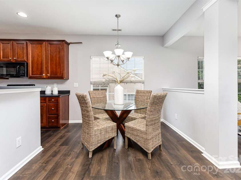 10198 Tintinhull Drive, Indian Land, SC 29707.  MLS# CAR4265539, YatesRealty ID 25357. Breakfast area with newer LVP flooring, installed in 2021.