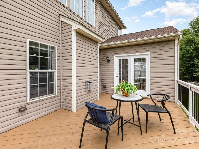 10198 Tintinhull Drive, Indian Land, SC 29707.  MLS# CAR4265539, YatesRealty ID 25357. Freshly stained back deck with railing with a door, just off your sunroom.