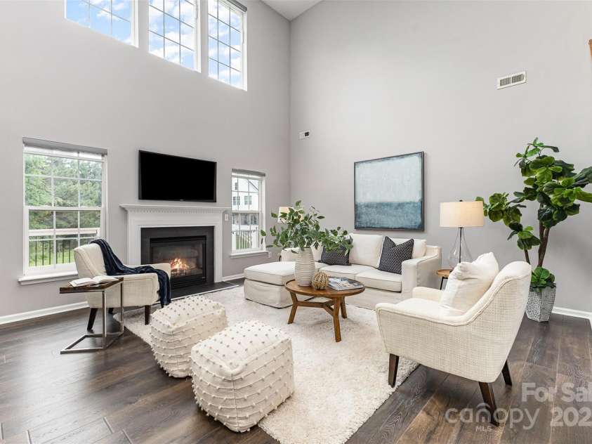 10198 Tintinhull Drive, Indian Land, SC 29707.  MLS# CAR4265539, YatesRealty ID 25357. Grand 2-story great room with loads of windows, gas fireplace and LVP flooring.